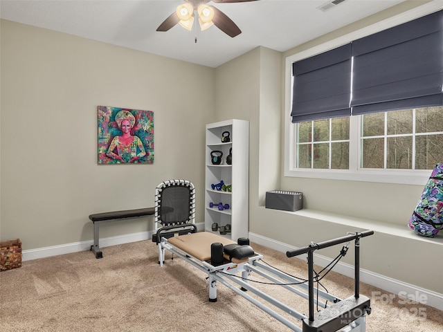 exercise room featuring carpet flooring and ceiling fan