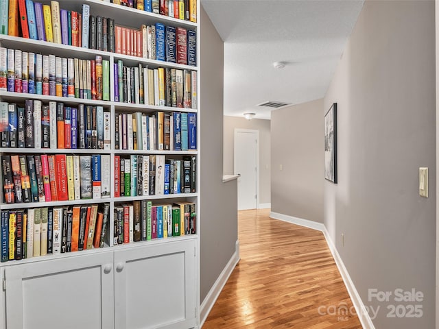 hallway with light wood-type flooring