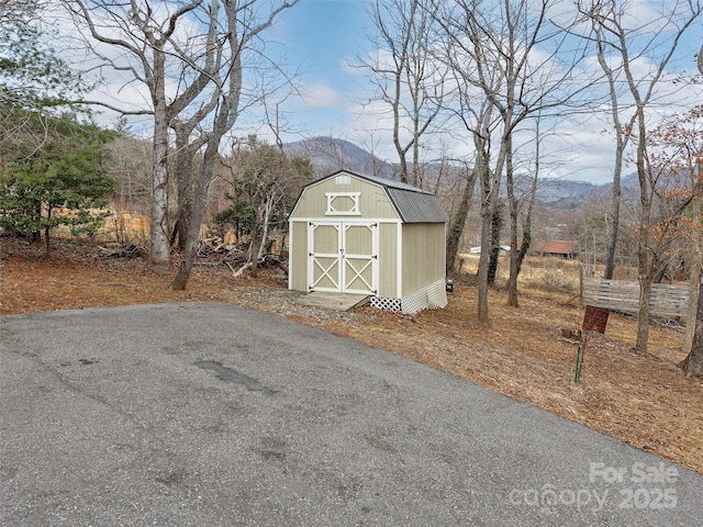 view of outbuilding featuring a mountain view