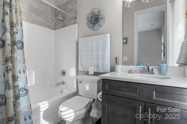 full bathroom featuring shower / bath combination with curtain, vanity, and toilet