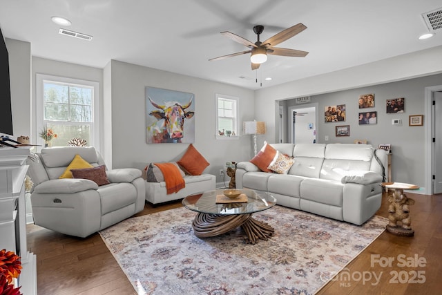 living room with hardwood / wood-style floors and ceiling fan