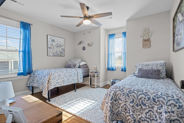 bedroom featuring hardwood / wood-style flooring and ceiling fan