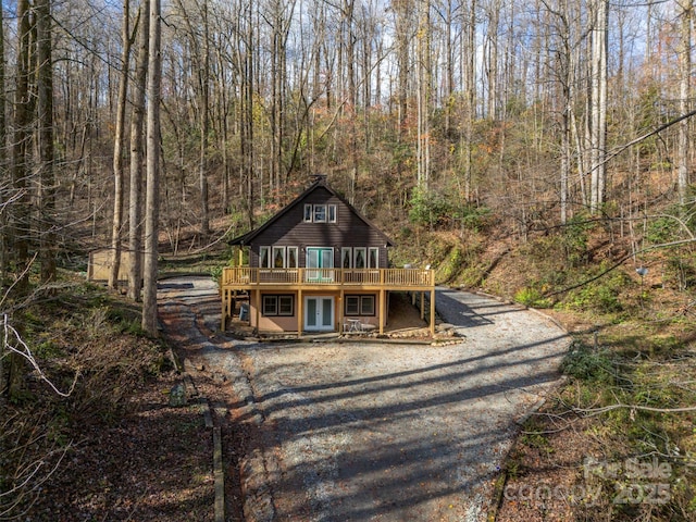 view of front of home featuring french doors and a wooden deck