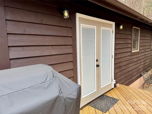 doorway to property featuring french doors and a wooden deck