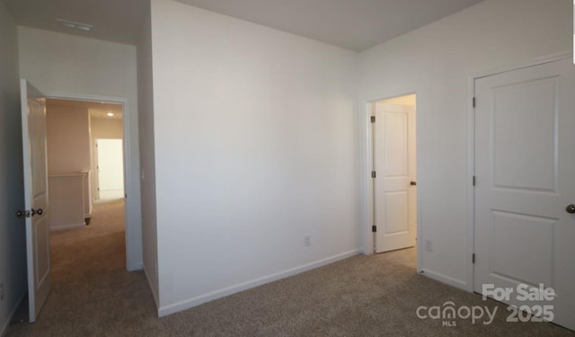 unfurnished bedroom featuring carpet flooring