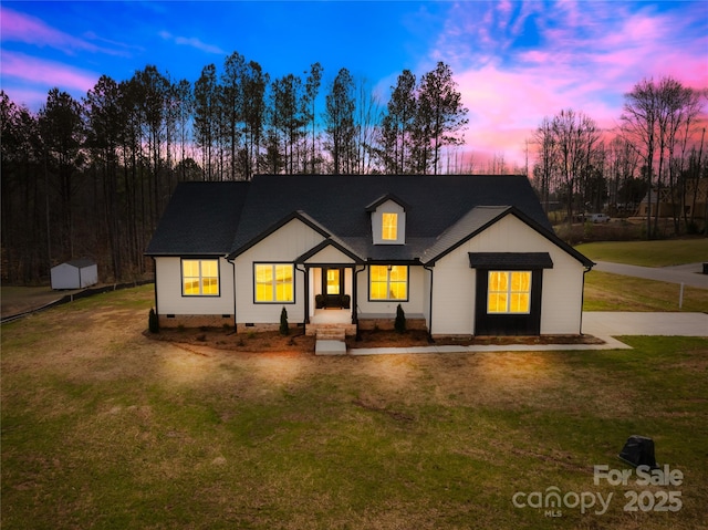 modern farmhouse style home with a yard