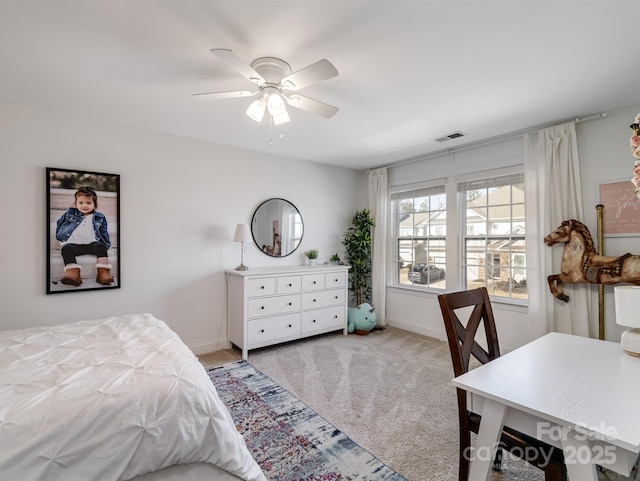 carpeted bedroom with ceiling fan