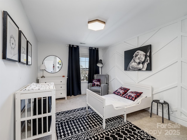 bedroom featuring light carpet