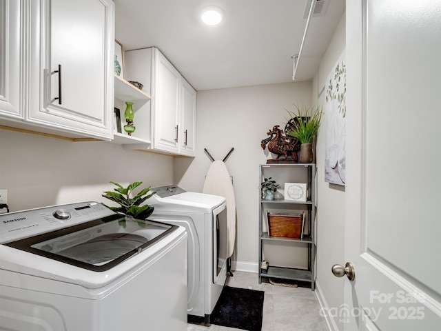 laundry area with cabinets and independent washer and dryer