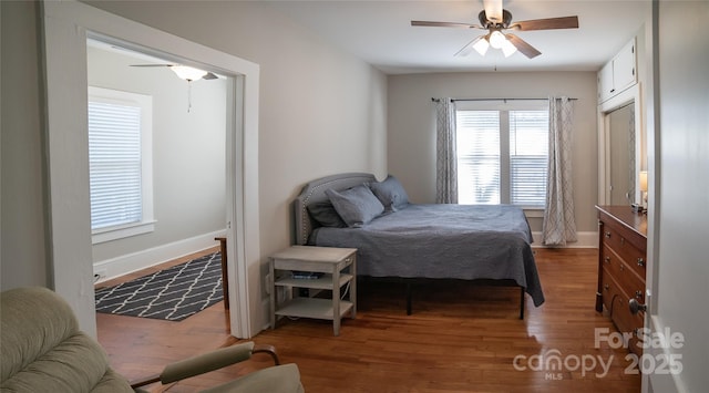 bedroom featuring hardwood / wood-style flooring and ceiling fan