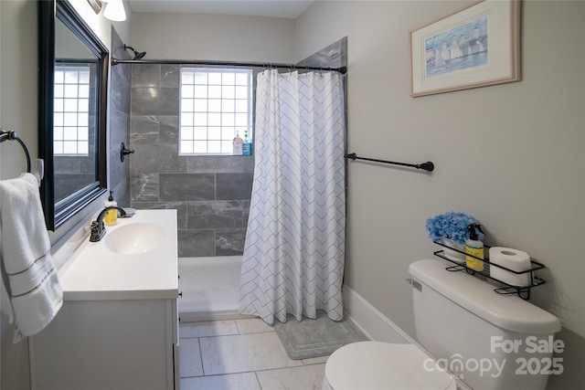 bathroom featuring vanity, toilet, and walk in shower