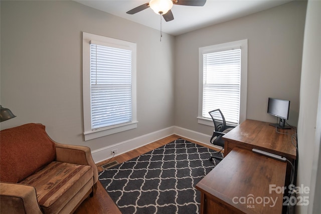 office area with hardwood / wood-style flooring and ceiling fan