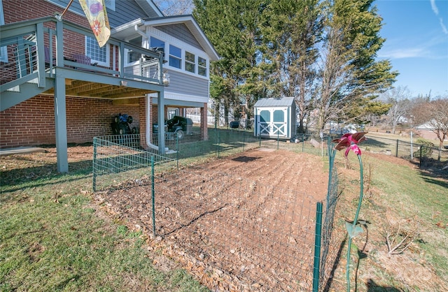 exterior space featuring a deck and a storage unit