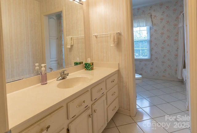 bathroom with vanity, toilet, and tile patterned flooring