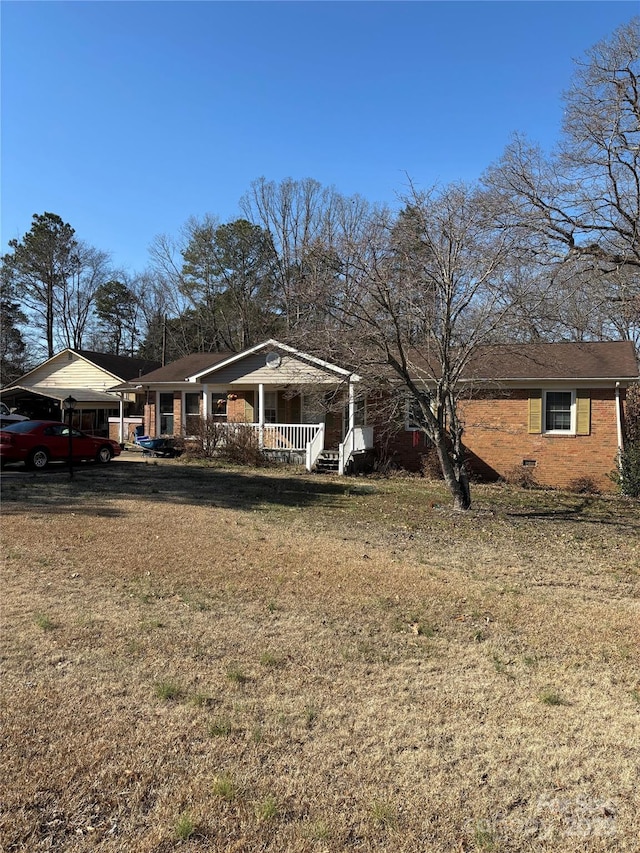 exterior space featuring a yard and covered porch