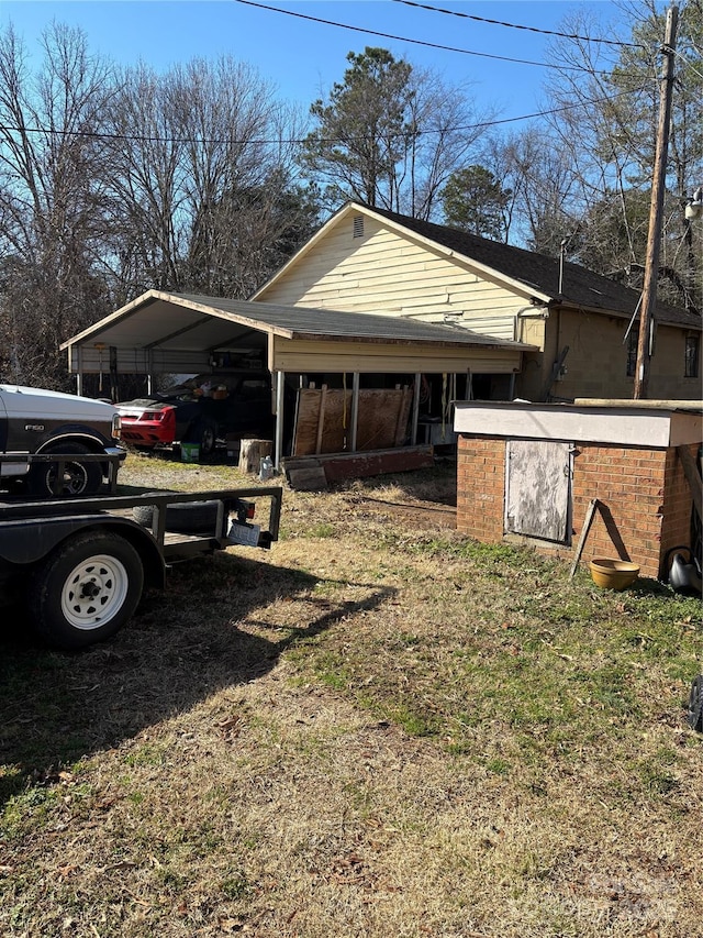 view of side of property featuring a carport