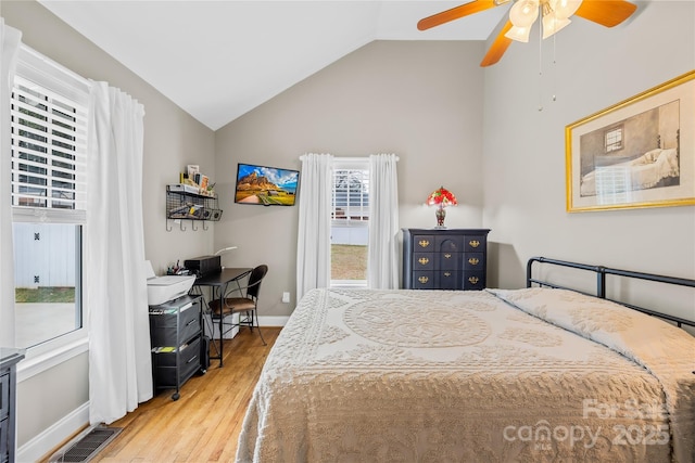 bedroom with vaulted ceiling, wood-type flooring, and ceiling fan