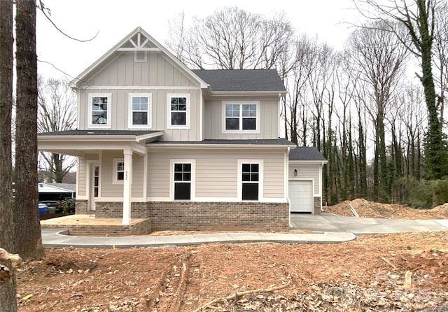 craftsman house featuring a porch and a garage