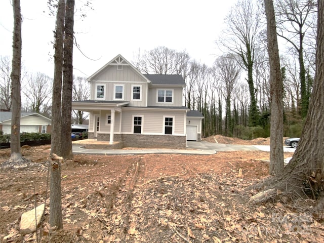 view of front of property featuring a porch and a garage