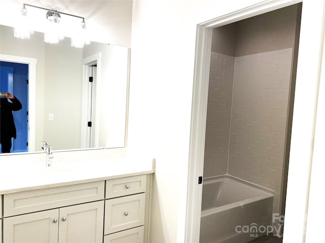 bathroom with vanity and bathing tub / shower combination