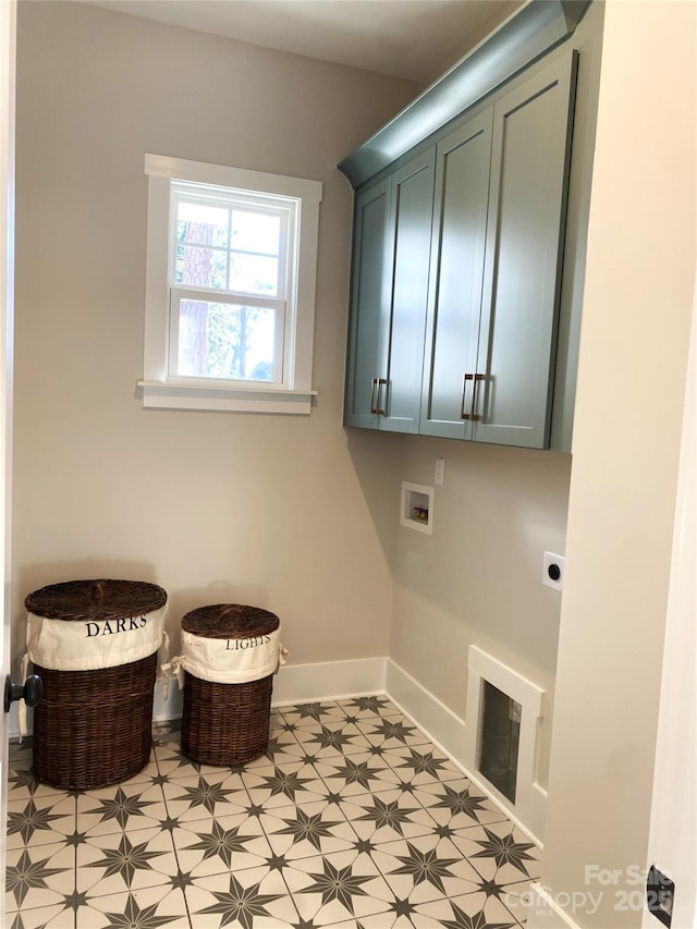 laundry area featuring light floors, hookup for a washing machine, cabinet space, electric dryer hookup, and baseboards