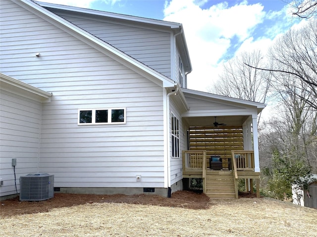 view of home's exterior with crawl space, ceiling fan, and central AC