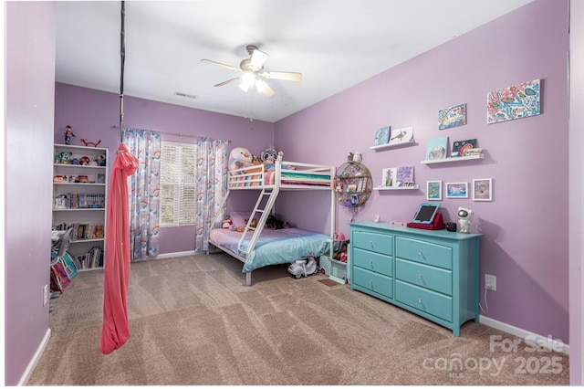 bedroom featuring light colored carpet and ceiling fan