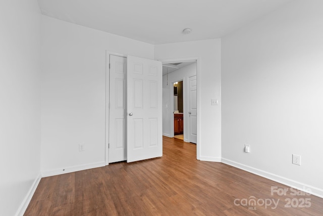 unfurnished room with hardwood / wood-style floors