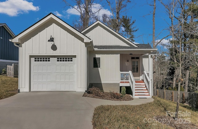 view of front of house with a garage and covered porch