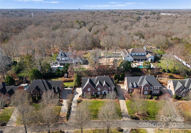 bird's eye view featuring a residential view and a forest view