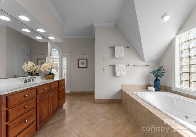 full bathroom with a garden tub, crown molding, vaulted ceiling, vanity, and tile patterned floors