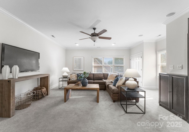 living room featuring light carpet, crown molding, visible vents, and baseboards