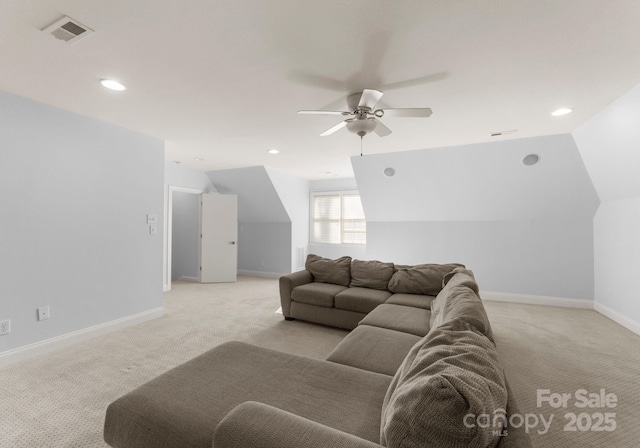 living room with visible vents, baseboards, light colored carpet, ceiling fan, and vaulted ceiling