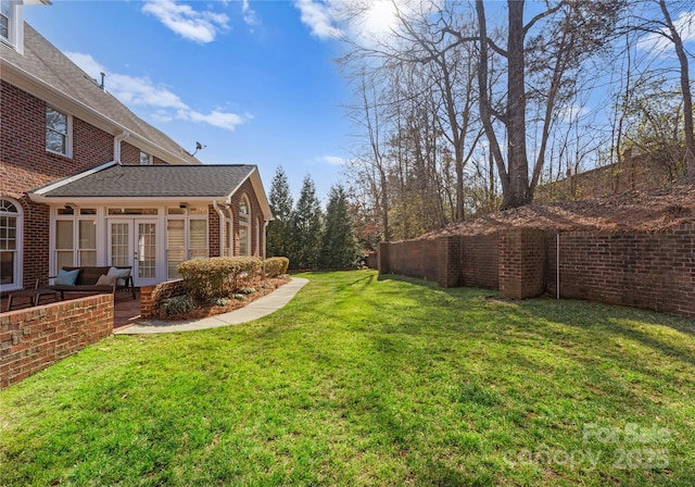 view of yard featuring french doors