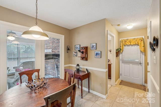 406 Brief Rd W, Indian Trail, NC 28079 - dining area with a textured ceiling, baseboards, and light tile patterned floors