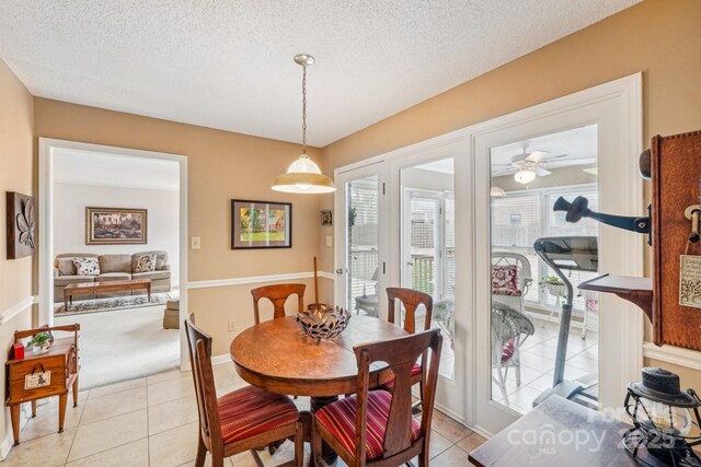 406 Brief Rd W, Indian Trail, NC 28079 - dining room with a textured ceiling, baseboards, ceiling fan, and light tile patterned floors