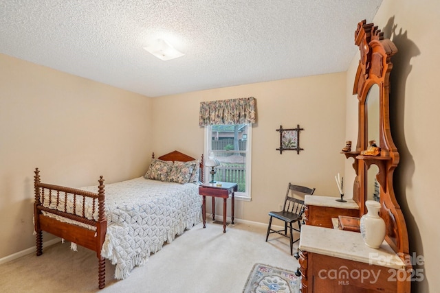 406 Brief Rd W, Indian Trail, NC 28079 - bedroom featuring baseboards, a textured ceiling, and light colored carpet