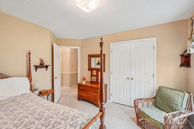 406 Brief Rd W, Indian Trail, NC 28079 - bedroom featuring light carpet, a textured ceiling, and a closet