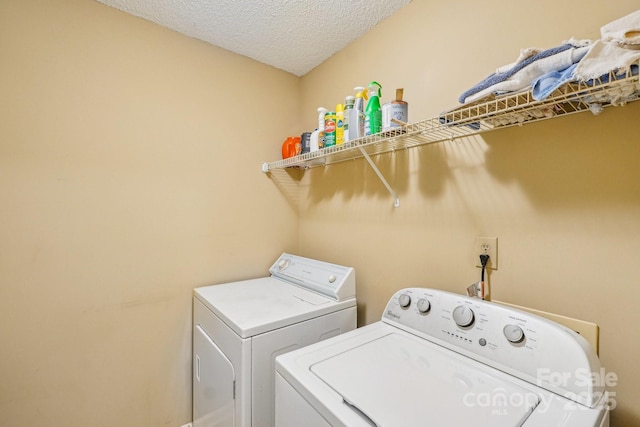 406 Brief Rd W, Indian Trail, NC 28079 - washroom with a textured ceiling, washer and dryer, and laundry area
