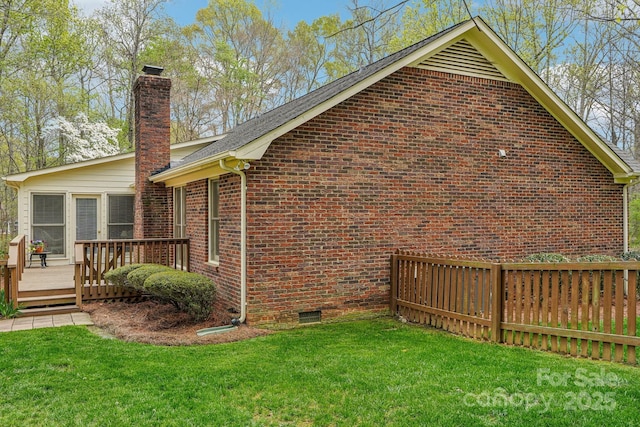 406 Brief Rd W, Indian Trail, NC 28079 - view of property exterior with a wooden deck, a chimney, crawl space, fence, and brick siding