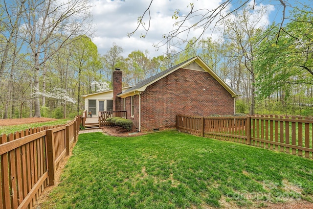 406 Brief Rd W, Indian Trail, NC 28079 - exterior space featuring a chimney, a deck, brick siding, fence, and crawl space