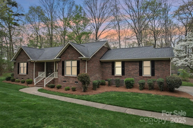 406 Brief Rd W, Indian Trail, NC 28079 - ranch-style house with a lawn, a shingled roof, and brick siding