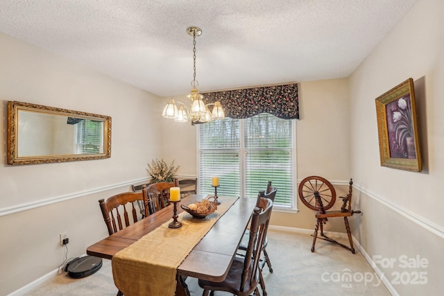 406 Brief Rd W, Indian Trail, NC 28079 - dining area with a textured ceiling, a notable chandelier, baseboards, and light carpet