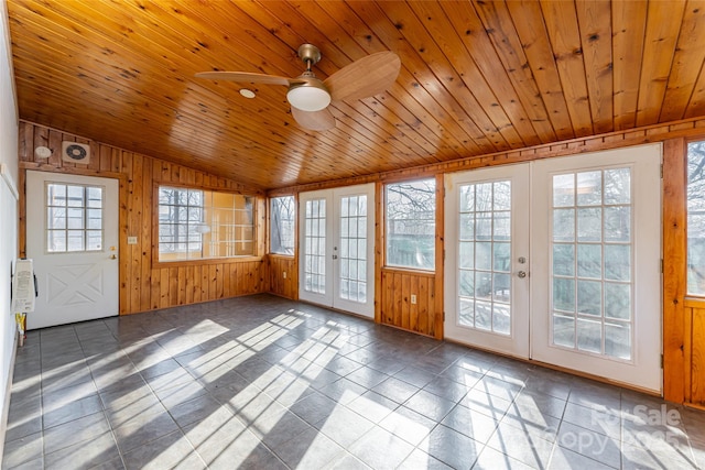 unfurnished sunroom with lofted ceiling, wood ceiling, french doors, and ceiling fan