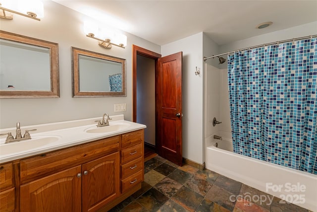 bathroom featuring vanity and shower / bath combo