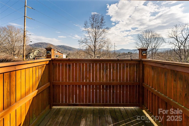 wooden deck featuring a mountain view