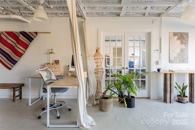 office space featuring concrete flooring and french doors