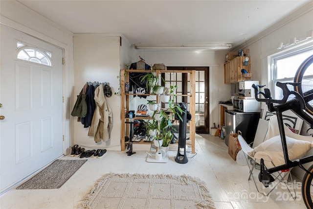 interior space with crown molding