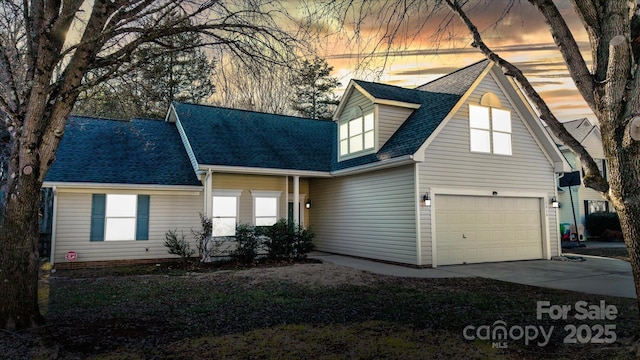 cape cod house with a garage