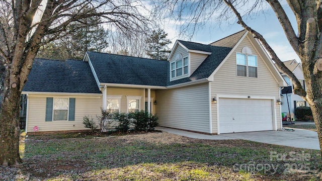 new england style home featuring a garage